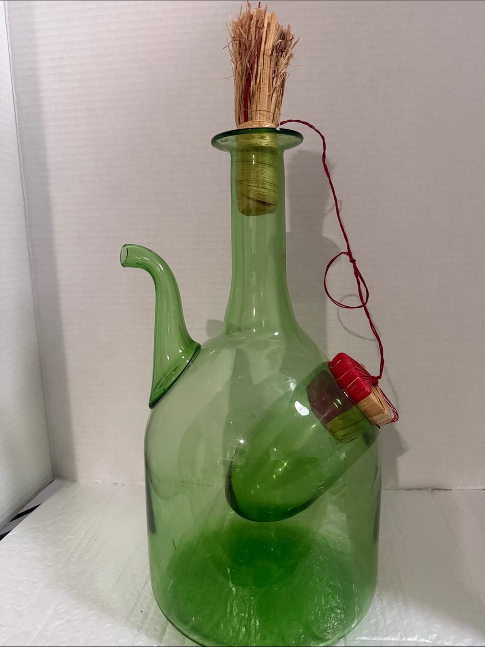 Vintage Italian green glass wine decanter featuring an integrated ice chamber